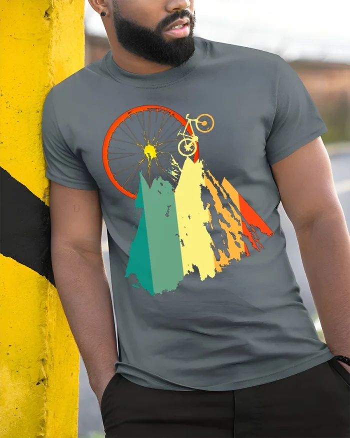 Mountain Biking Adventure Graphic T-Shirt - model in grey shirt leaning against column