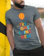 Try Something New T-Shirt Motivational Hot Air Balloon - model in grey shirt leaning against column