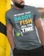 Daddy Doesn’t Fish All The Time T-Shirt Funny Gift - model in grey shirt leaning against column