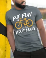 Funny Bicycle Rider Graphic T-Shirt Put Fun Between Legs - model in grey shirt leaning against column