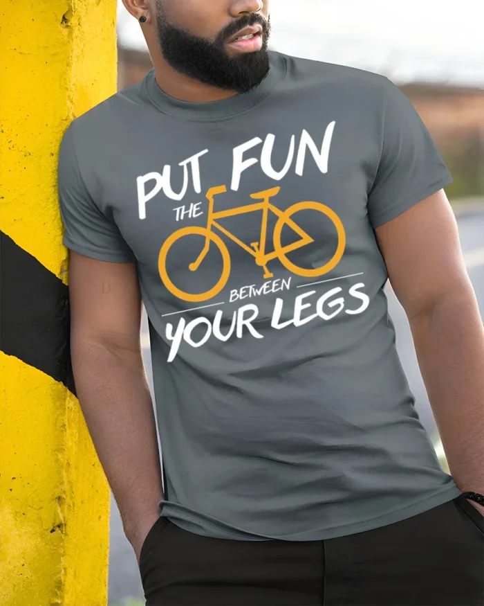 Funny Bicycle Rider Graphic T-Shirt Put Fun Between Legs - model in grey shirt leaning against column