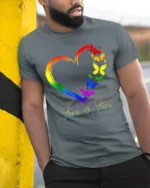 Love is Love Rainbow Heart Pride T-Shirt with Butterflies - model in grey shirt leaning against column