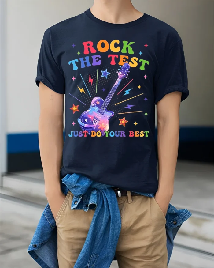Rock the Test T-shirt Rainbow Guitar Motivational - model wearing navy shirt, hands in pockets