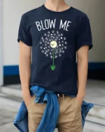 Funny Blow Me Dandelion Graphic T-Shirt for Adults - model wearing navy shirt, hands in pockets