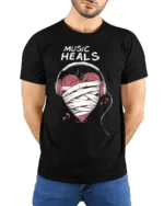 Music Heals T-shirt with Heart Headphones Design - model wearing black shirt, hands behind back