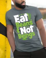 Eat Beans Not Beings Vegan T-shirt for Plant-Based Lovers - model in grey shirt leaning against column