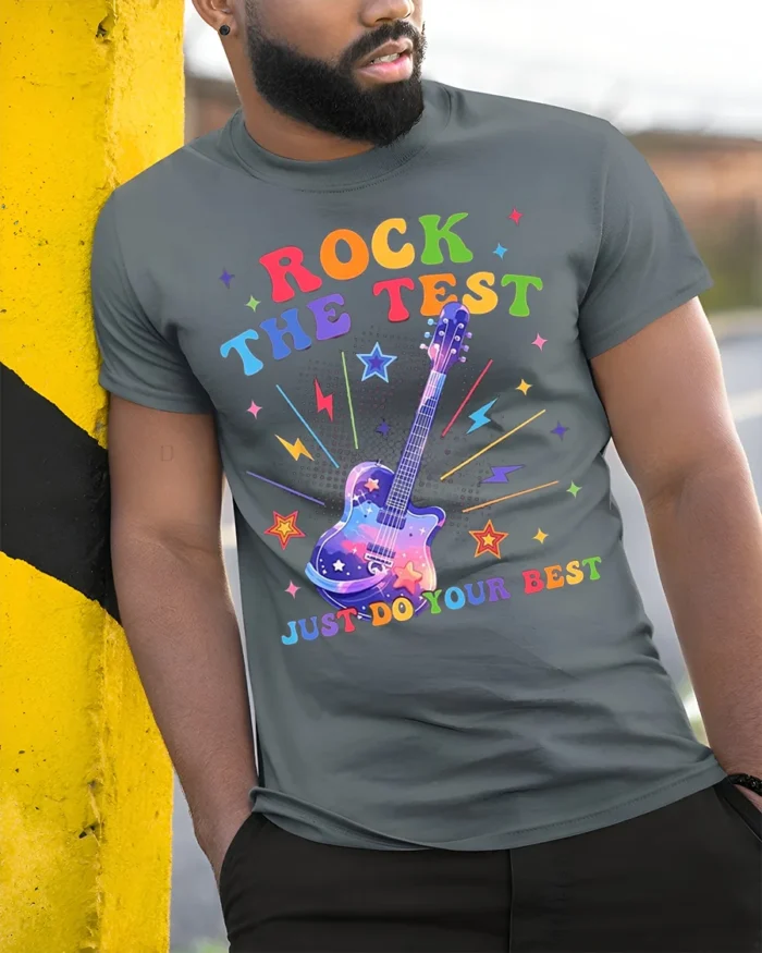 Rock the Test T-shirt Rainbow Guitar Motivational - model in grey shirt leaning against column