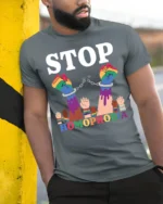 Stop Homophobia T-shirt LGBTQ Pride Equality Protest - model in grey shirt leaning against column