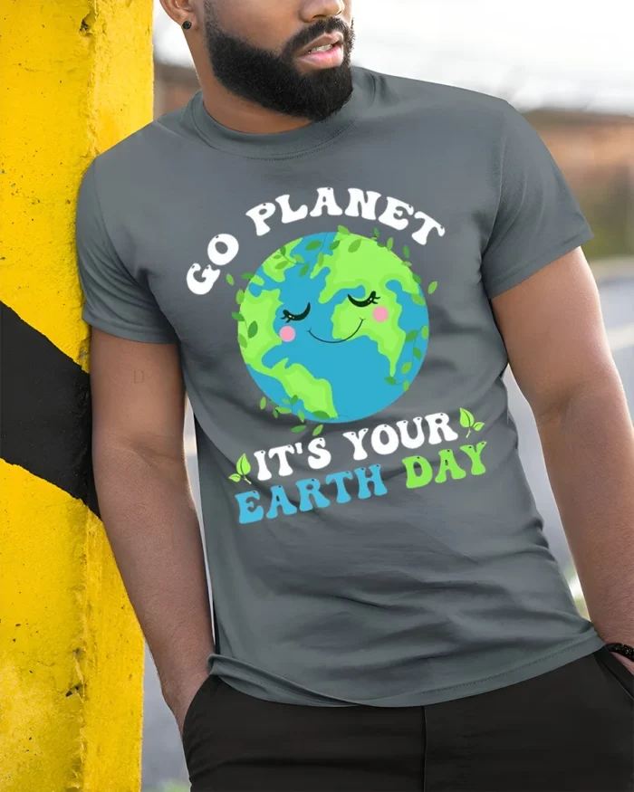 Go Planet It’s Your Earth Day T-Shirt Funny Eco Graphic - model in grey shirt leaning against column