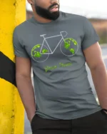 Green Power Bicycle Earth T-Shirt for Eco-Friendly Riders - model in grey shirt leaning against column