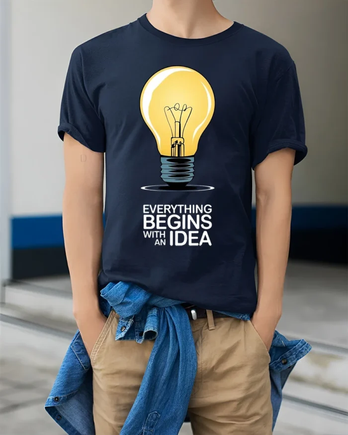 Everything Begins With an Idea Light Bulb T-Shirt - model wearing navy shirt, hands in pockets