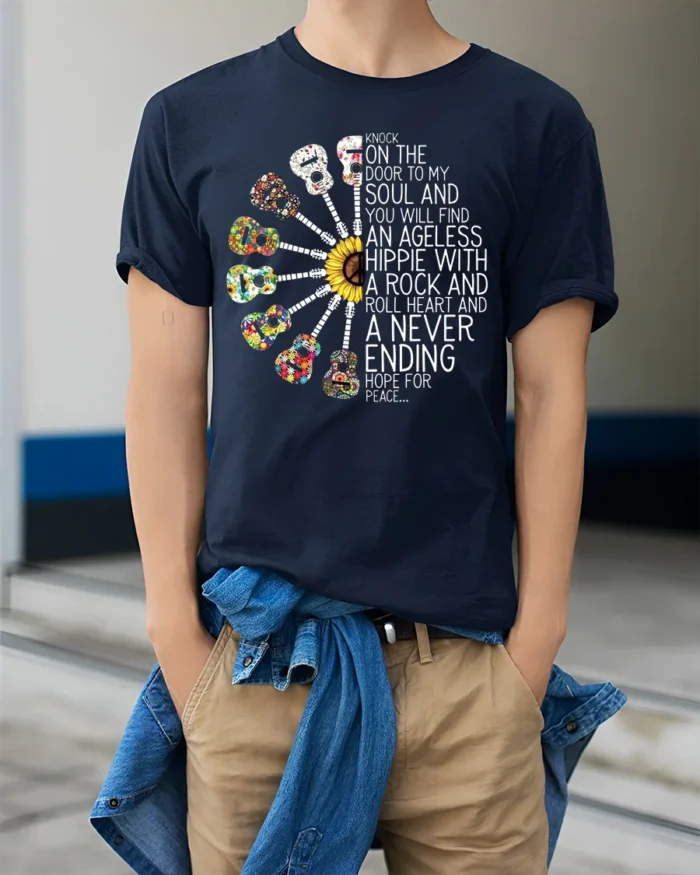 Ageless Hippie Guitar T-Shirt with Peace and Rock Style - model wearing navy shirt, hands in pockets