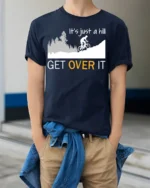 Funny Cycling T-Shirt It’s Just a Hill Get Over It Tee - model wearing navy shirt, hands in pockets