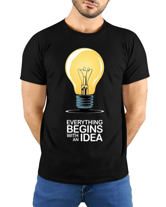Everything Begins With an Idea Light Bulb T-Shirt - model wearing black shirt, hands behind back