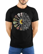 Ageless Hippie Guitar T-Shirt with Peace and Rock Style - model wearing black shirt, hands behind back