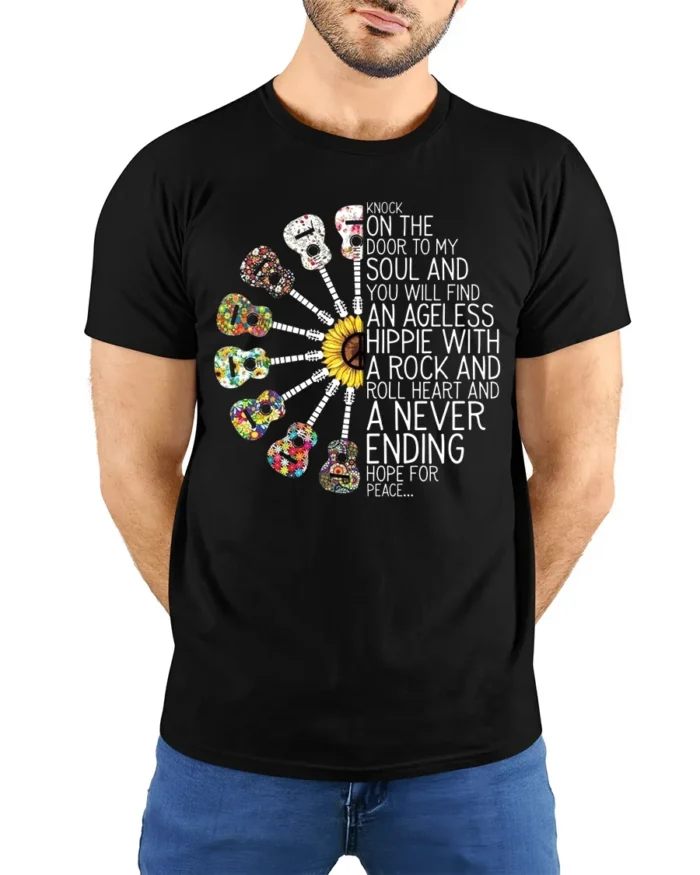 Ageless Hippie Guitar T-Shirt with Peace and Rock Style - model wearing black shirt, hands behind back