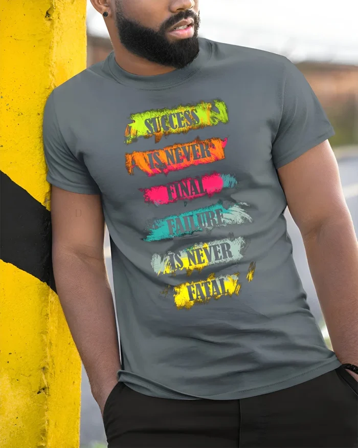 Motivational Quote T-Shirt Success Is Never Final - model in grey shirt leaning against column