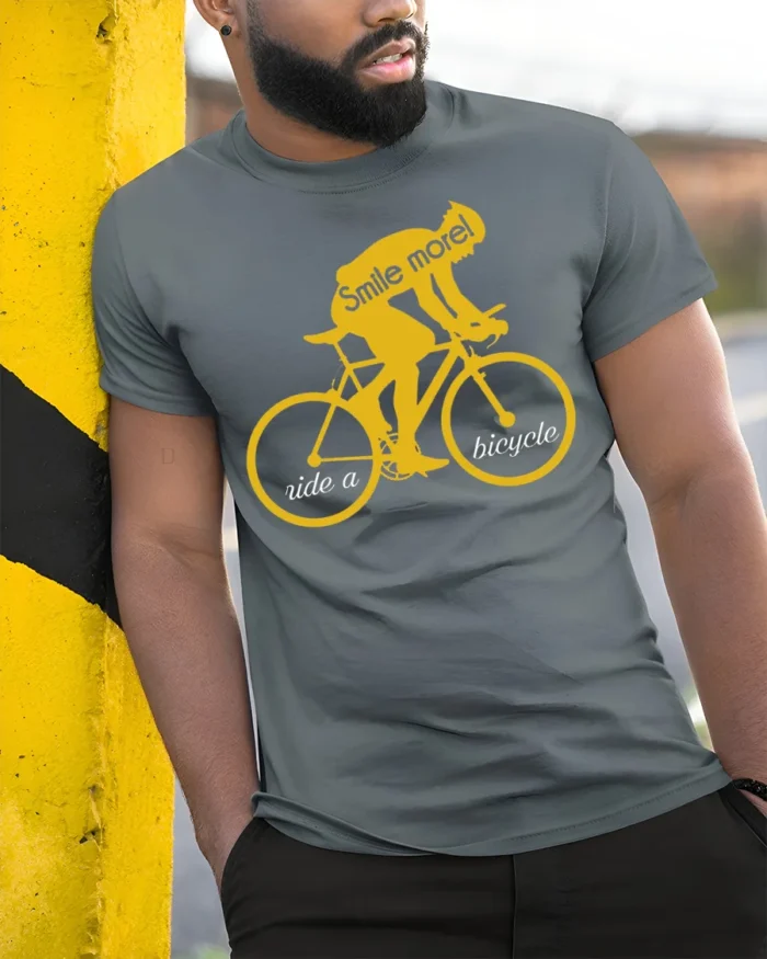 Smile More Ride a Bicycle Motivational Cycling T-Shirt - model in grey shirt leaning against column