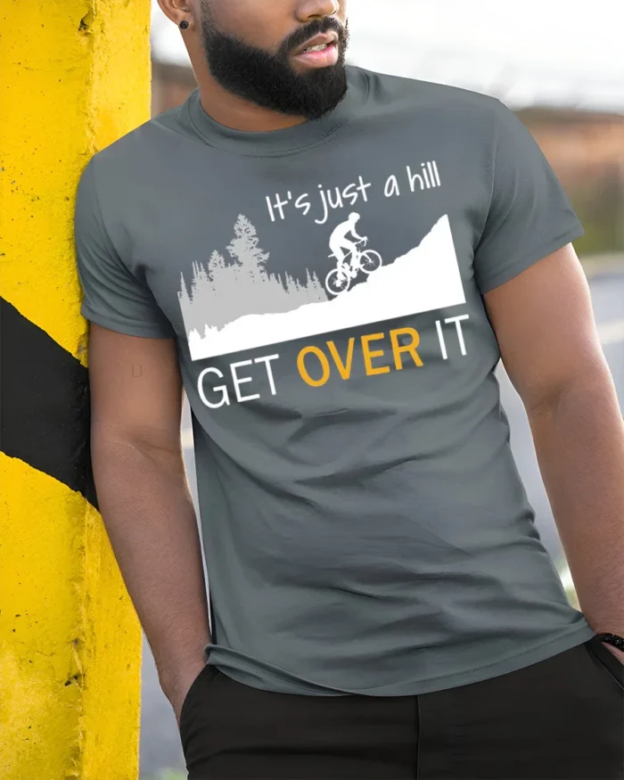 Funny Cycling T-Shirt It’s Just a Hill Get Over It Tee - model in grey shirt leaning against column