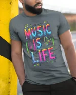 Colorful Music Is Life T-Shirt for Musicians and Fans - model in grey shirt leaning against column