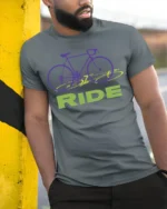 Retro Bike RIDE Graphic T-Shirt for Cyclists and Riders - model in grey shirt leaning against column