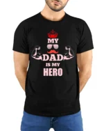 My Dad Is My Hero T-Shirt Funny Father’s Day Gift - model wearing black shirt, hands behind back