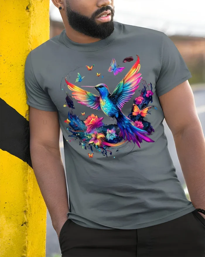 Colorful Hummingbird T-Shirt Floral Butterfly Art - model in grey shirt leaning against column