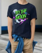To The Moon T-Shirt Retro Space Rocket Graphic - model wearing navy shirt, hands in pockets