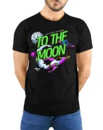 To The Moon T-Shirt Retro Space Rocket Graphic - model wearing black shirt, hands behind back