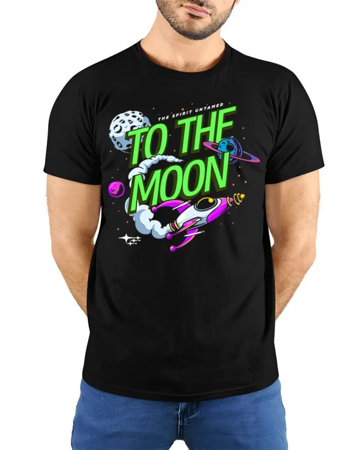 To The Moon T-Shirt Retro Space Rocket Graphic - model wearing black shirt, hands behind back