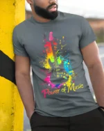 Power of Music Guitar T-Shirt Colorful Music Lover - model in grey shirt leaning against column