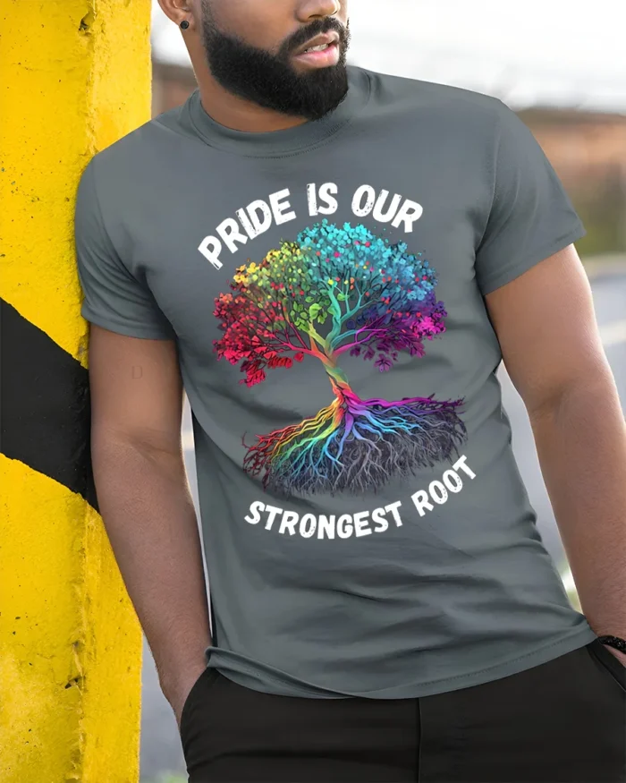 Pride Tree T-Shirt Strongest Root LGBTQ+ Unity - model in grey shirt leaning against column