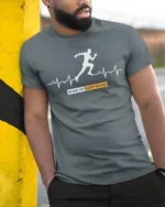 Wake Up Keep Going T-Shirt Motivational Runner - model in grey shirt leaning against column