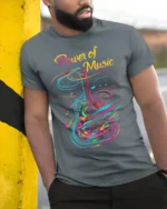 Colorful Guitar T-Shirt Power of Music Graphic - model in grey shirt leaning against column