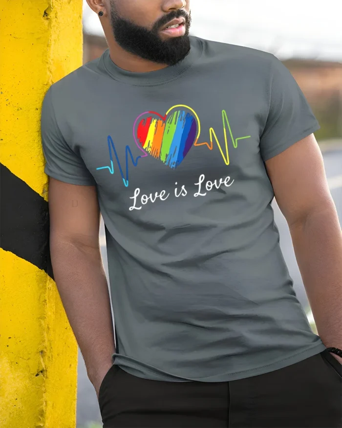 Love Is Love T-Shirt LGBTQ Rainbow Heart Pride - model in grey shirt leaning against column