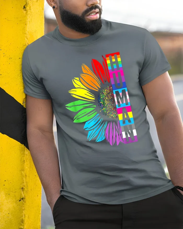 Human Pride T-Shirt Rainbow Sunflower LGBTQ+ Equality - model in grey shirt leaning against column