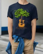 Tree Guitar Nature Music Graphic T-Shirt for Music Lovers - model wearing navy shirt, hands in pockets