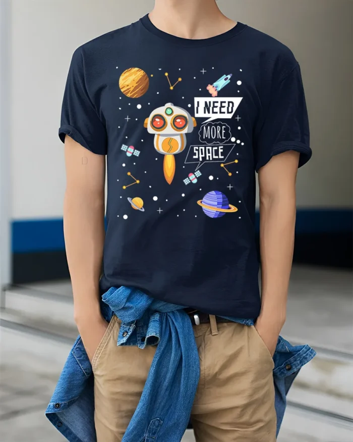 I Need More Space T-Shirt with Cute Robot and Planets - model wearing navy shirt, hands in pockets
