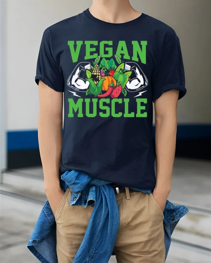 Vegan Muscle T-Shirt with Bold Veggie and Fitness Design - model wearing navy shirt, hands in pockets
