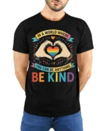Be Kind Rainbow Heart Pride T-Shirt with Positive Message - model wearing black shirt, hands behind back