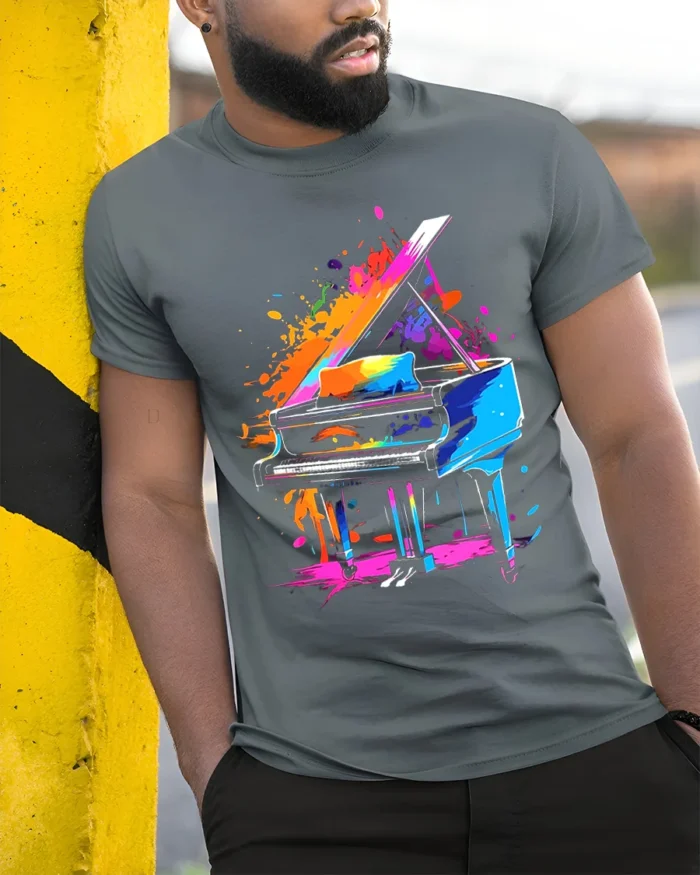 Color Splash Piano Art T-Shirt for Music and Art Lovers - model in grey shirt leaning against column