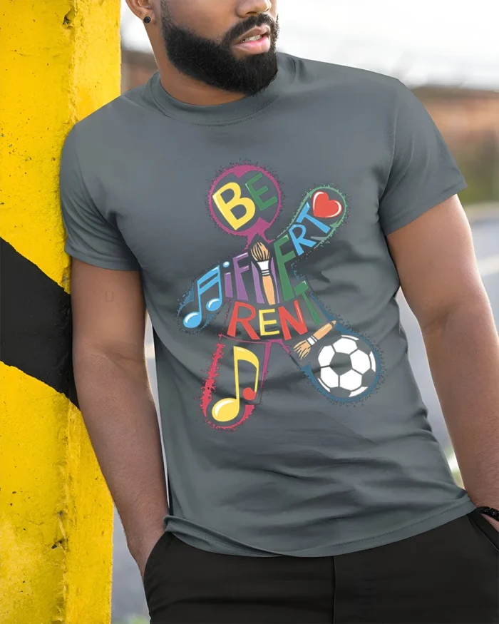 Be Different T-Shirt with Music, Art, and Sports Design - model in grey shirt leaning against column