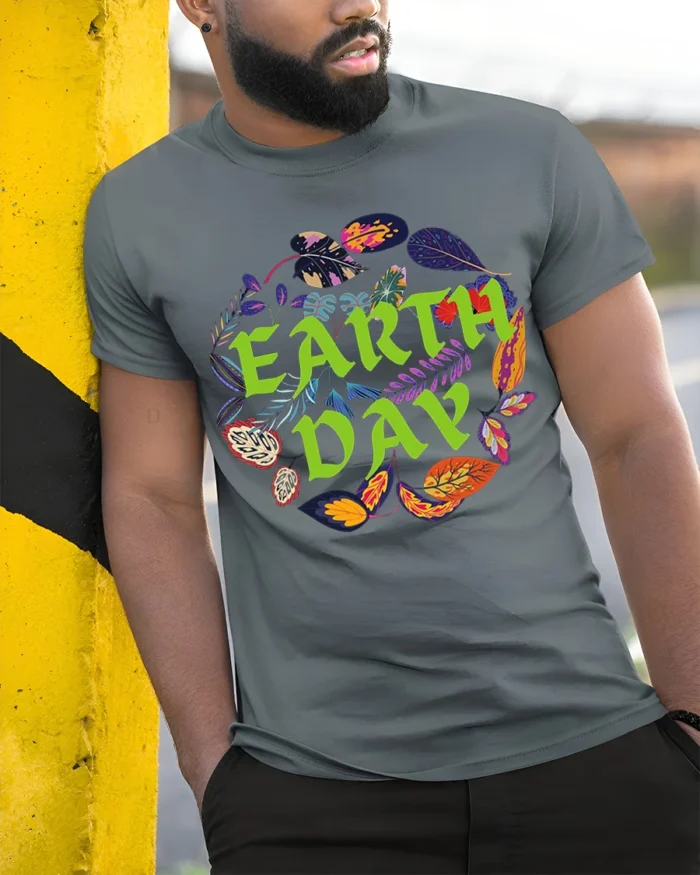 Earth Day T-Shirt with Colorful Leaves Nature Graphic - model in grey shirt leaning against column