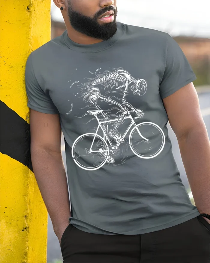 Skeleton Riding Bike T-Shirt for Cyclists and Gothic Fans - model in grey shirt leaning against column