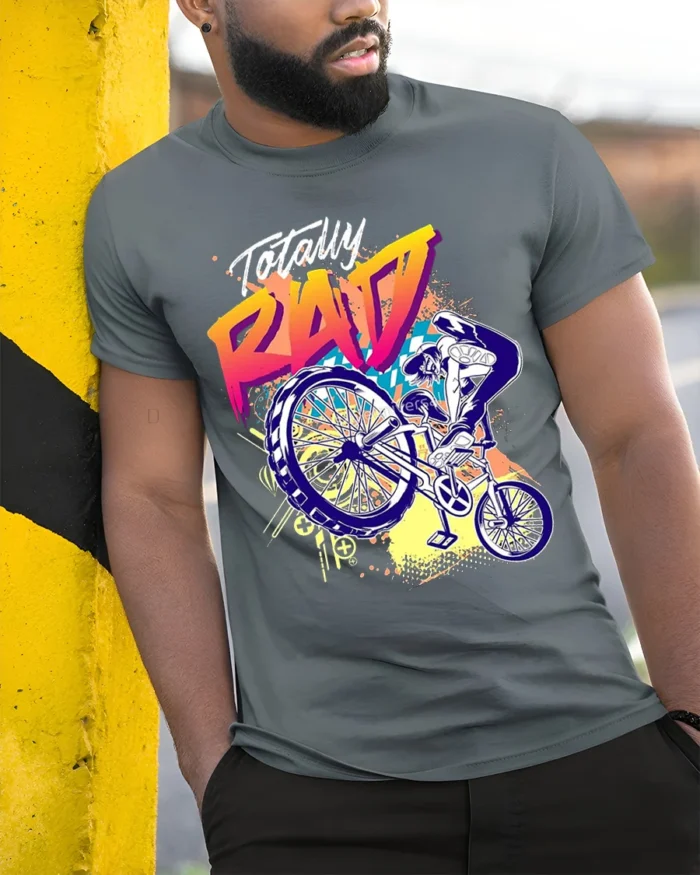 Totally Rad BMX Trick T-Shirt with 80s Retro Vibe Design - model in grey shirt leaning against column