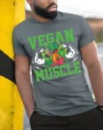 Vegan Muscle T-Shirt with Bold Veggie and Fitness Design - model in grey shirt leaning against column