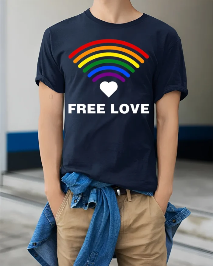 Free Love Rainbow Heart LGBTQ Pride T-Shirt Unisex Soft - model wearing navy shirt, hands in pockets