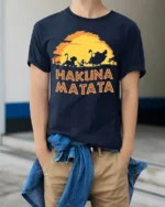 Hakuna Matata Sunset T-Shirt Carefree Jungle Vibes - model wearing navy shirt, hands in pockets