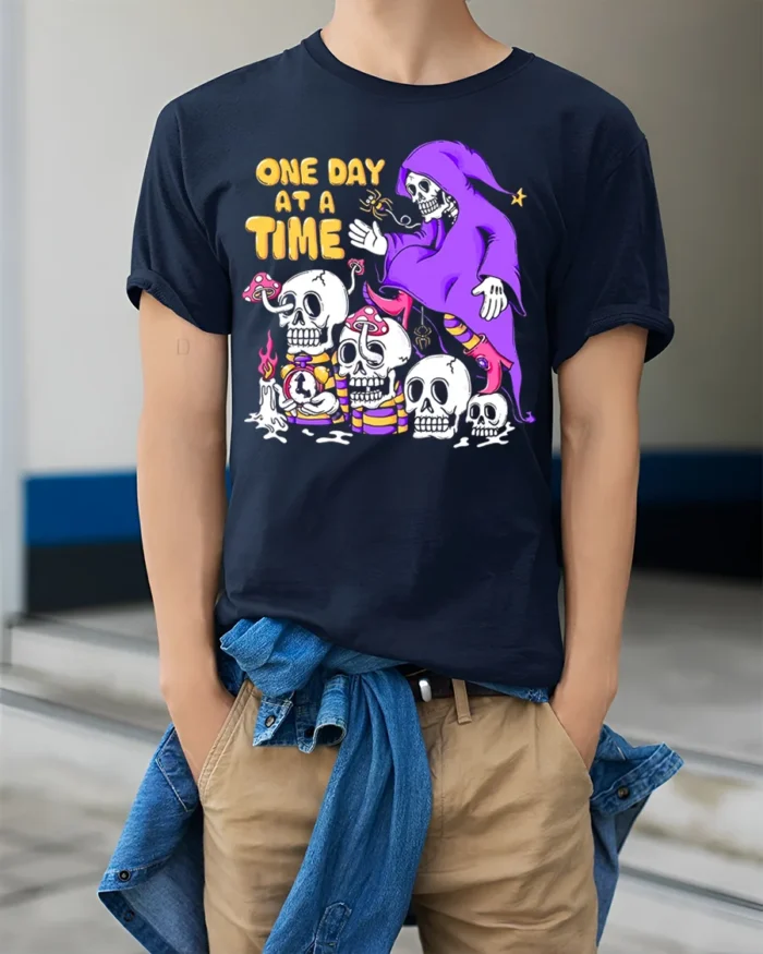 One Day at a Time Skeleton T-Shirt Grim Reaper Graphic - model wearing navy shirt, hands in pockets