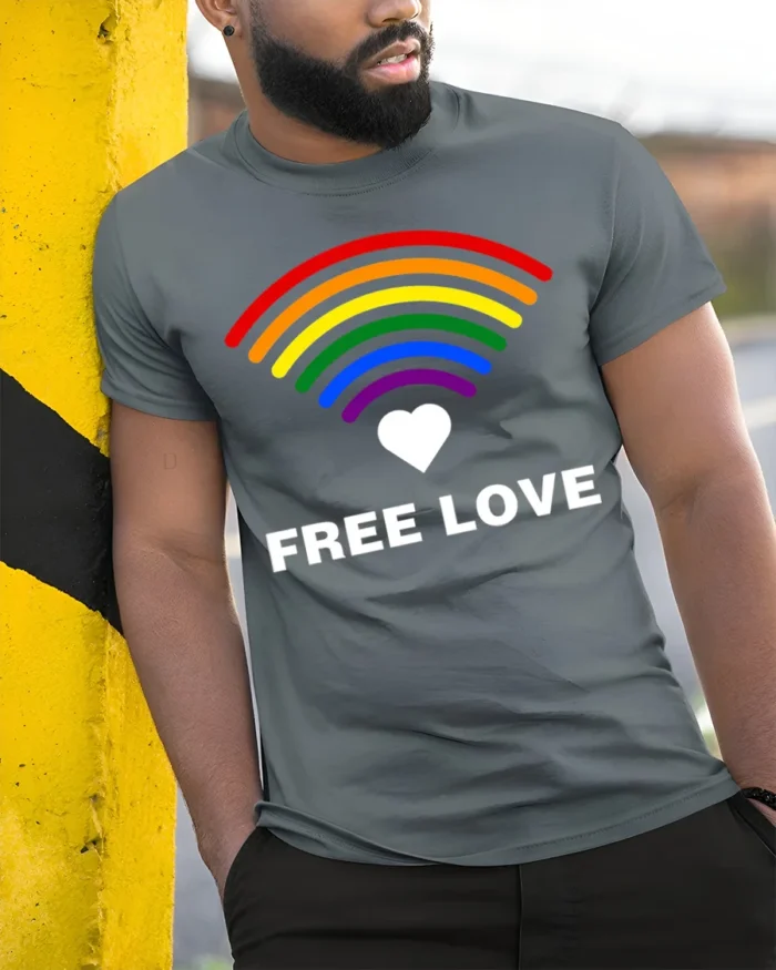 Free Love Rainbow Heart LGBTQ Pride T-Shirt Unisex Soft - model in grey shirt leaning against column